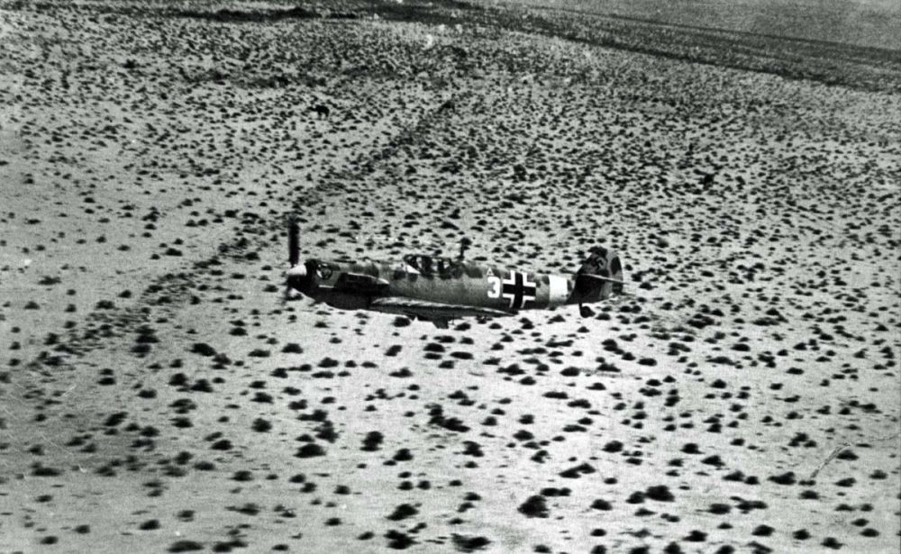 Bf 109 E-4 Trop, White 3, 1st Squadron of the 27th Fighter Squadron (1.-JG 27) over desert (2).jpg
