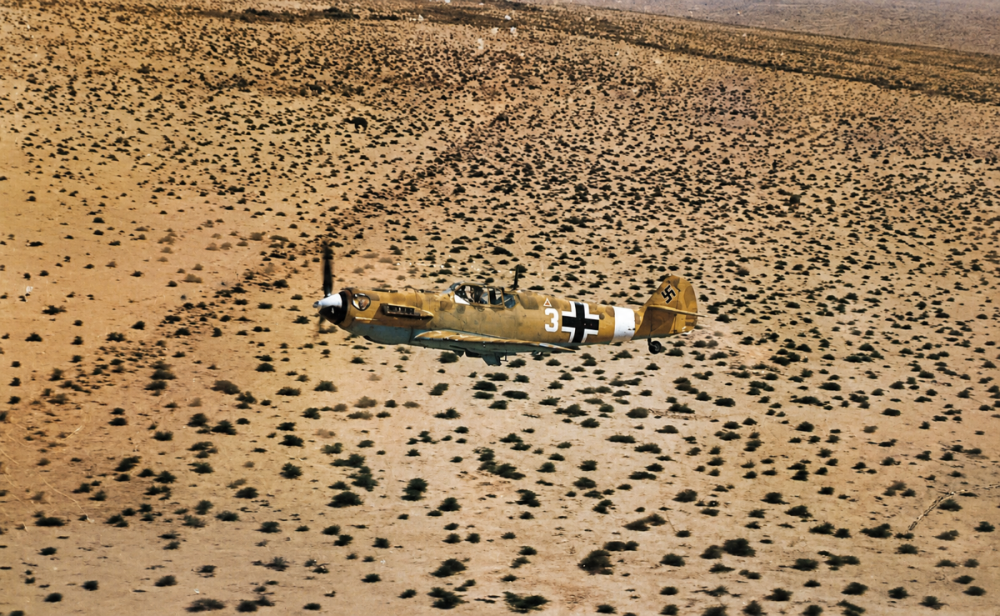 Bf 109 E-4 Trop, White 3, 1st Squadron of the 27th Fighter Squadron (1.-JG 27) over desert (2).png